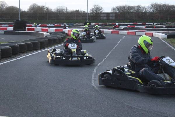 decorative image showing two karts racing