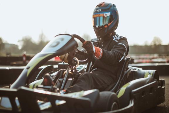 A photograph of a person karting.