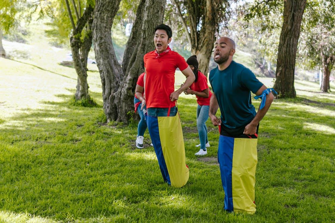 Contestants taking part in a sack race