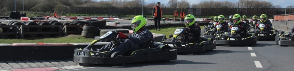An image of karts racing off the line