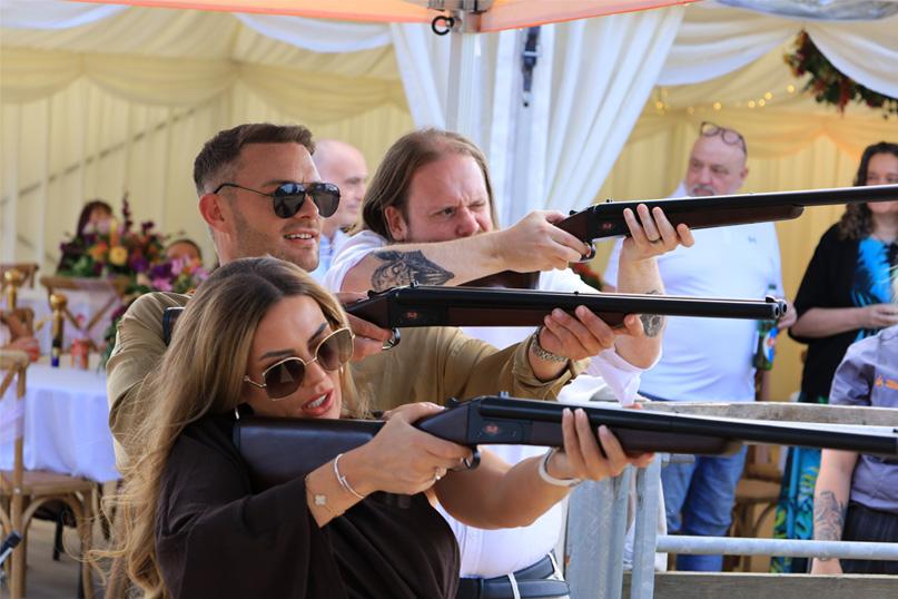 People laser clay pigeon shooting